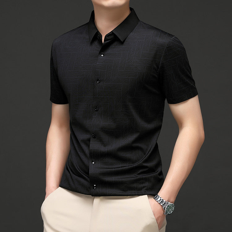 Men wearing Atmora black textured short sleeve shirt in an angled smart casual pose