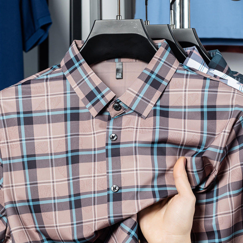 Close-up of Atmora men’s dusty rose heritage check short sleeve shirt showing collar and minor stretch fabric detail