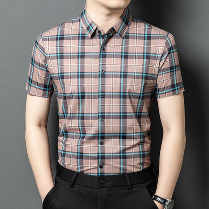 Men wearing Atmora dusty rose heritage check short sleeve shirt styled with black trousers