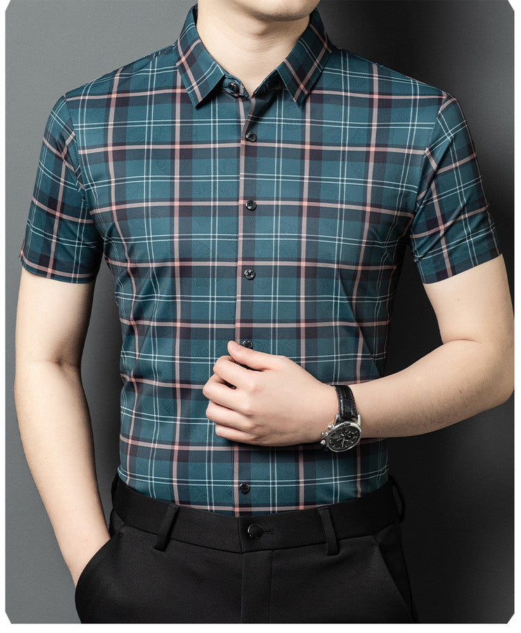 Men wearing Atmora teal slate heritage check short sleeve shirt styled with black trousers