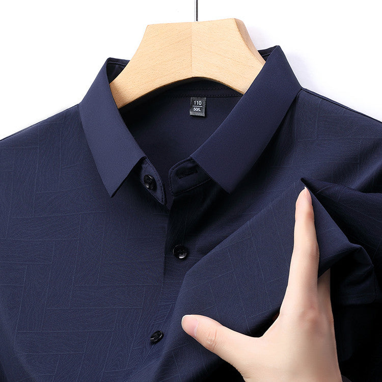Close-up of Atmora men’s navy blue textured short sleeve shirt showing imported stretch fabric and classic collar