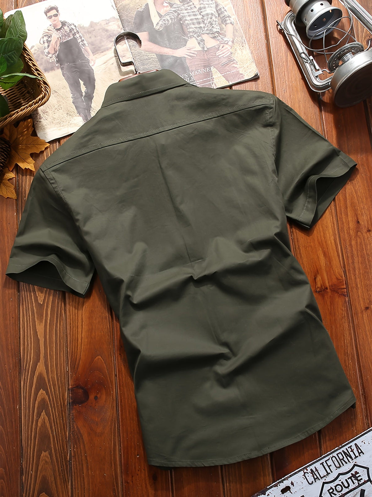 Back view of Atmora olive green woven utility short sleeve shirt showing yoke seam and clean solid finish