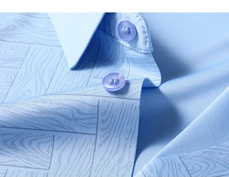 Close-up of Atmora sky blue textured shirt fabric with button and collar detail